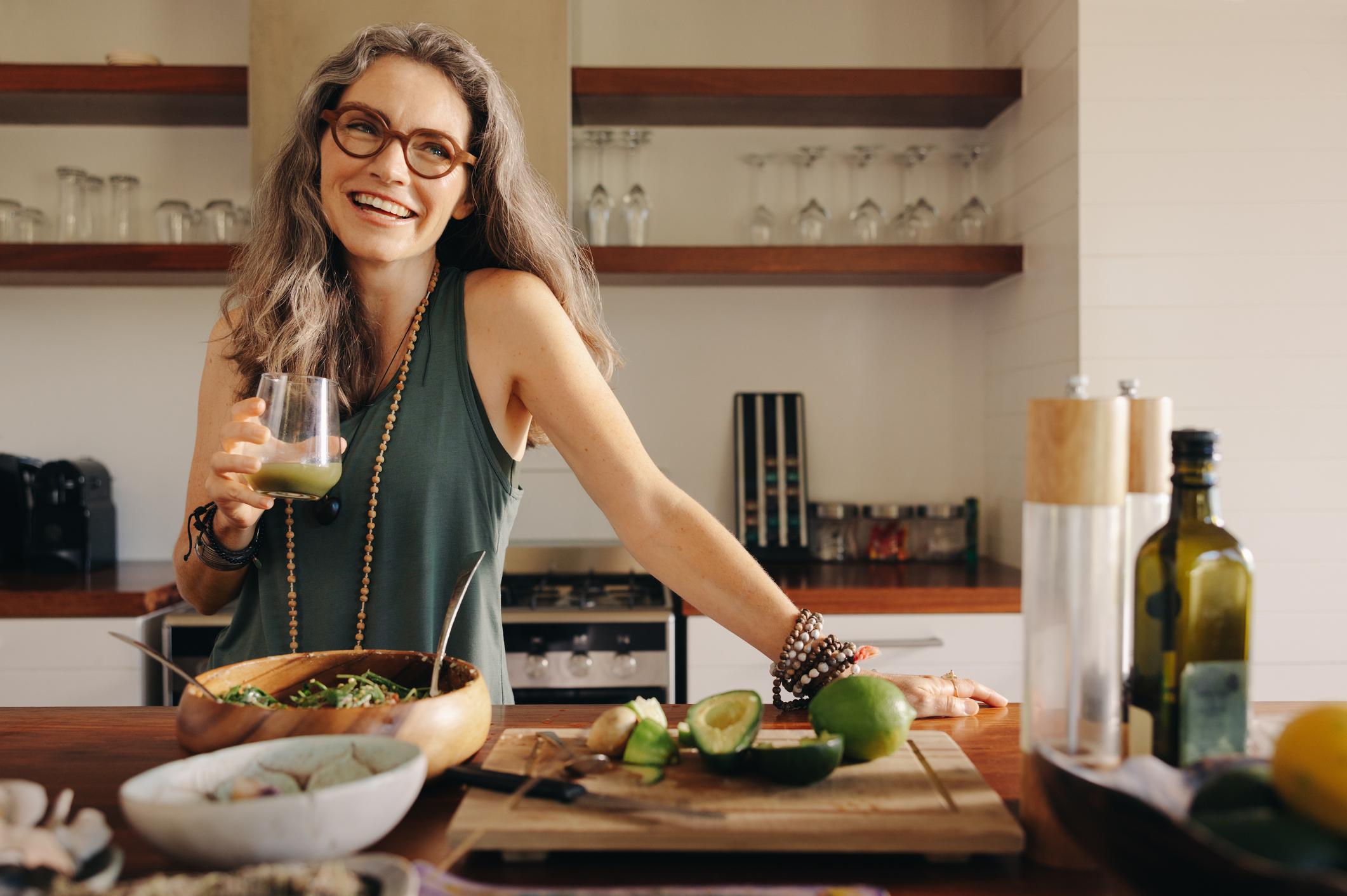 Healthy Senior Woman Smiling While Holding Some Green Juice