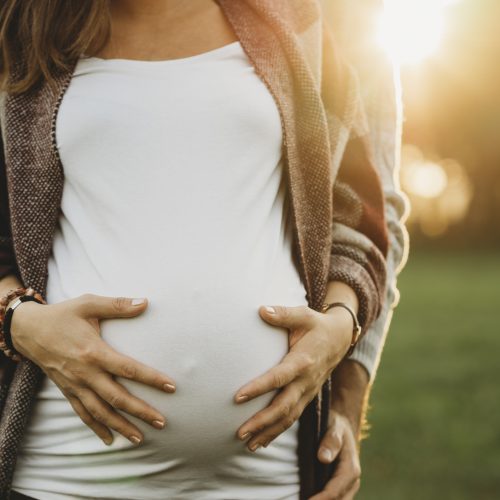 Future Parents Couple At Sunset