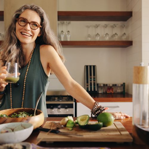 Healthy Senior Woman Smiling While Holding Some Green Juice